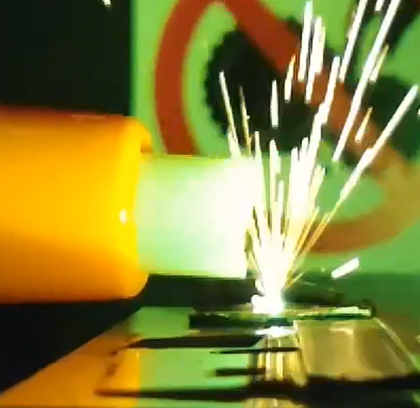 laser hitting a steel sample